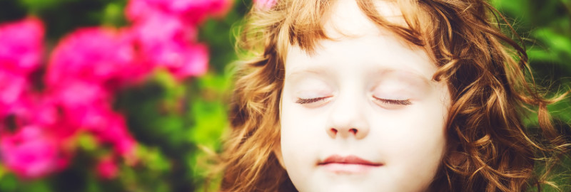 Picture of a young girl breathing deeply and relaxing
