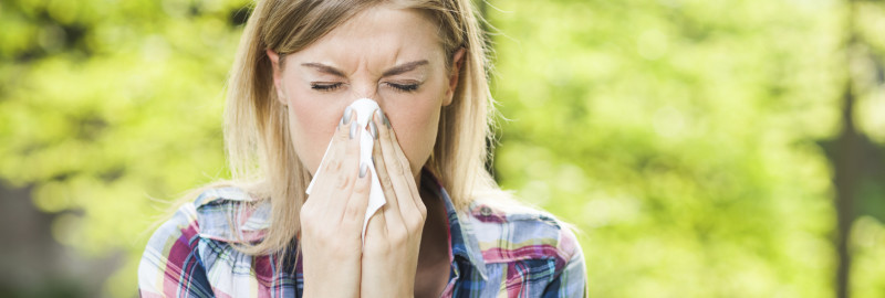 Picture of a woman sneezed using her handkerchief.