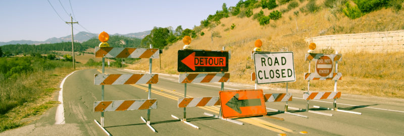Detour road closed and no entry signs on highway in California