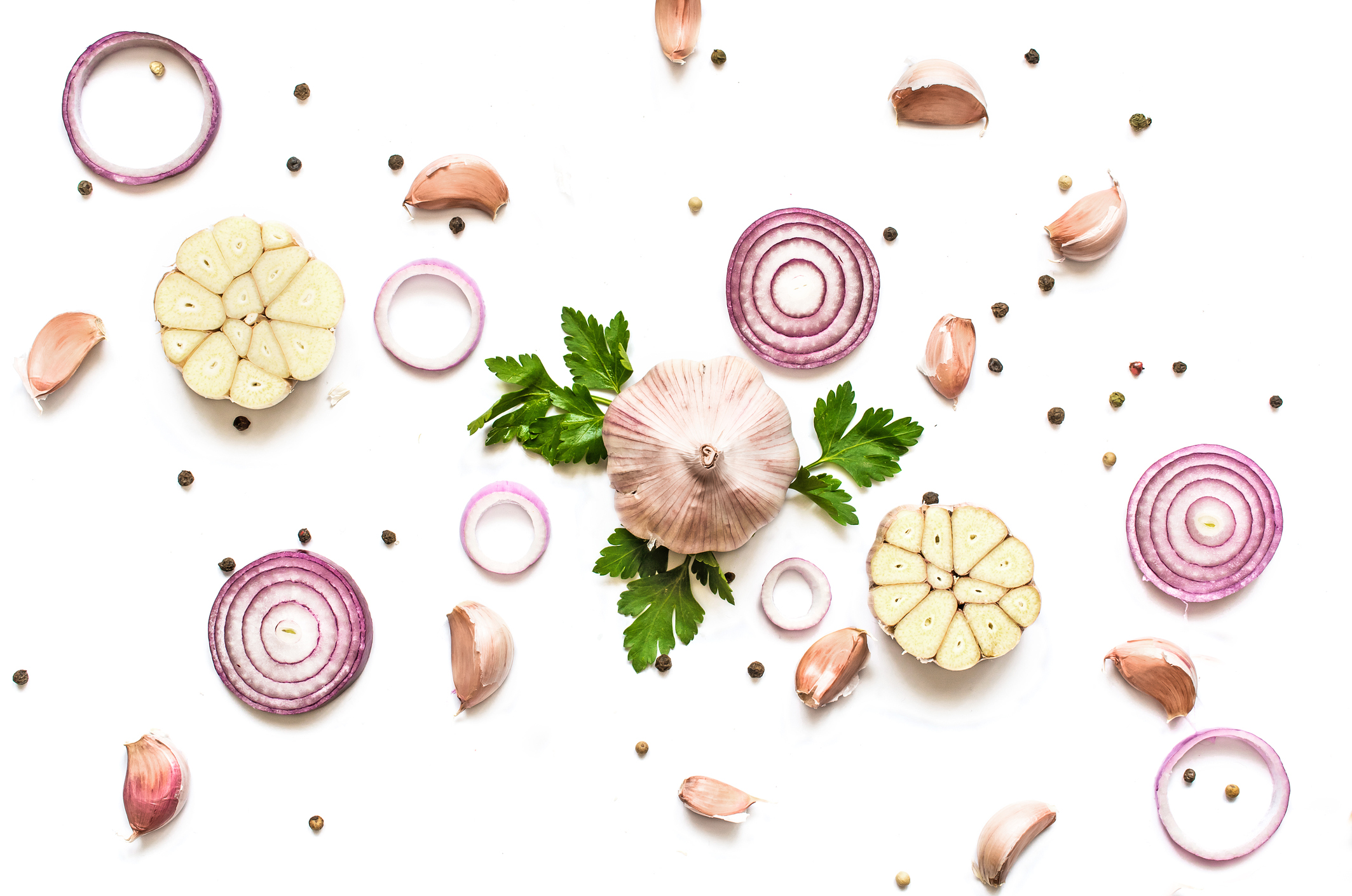 garlic, red onion, parsley and pepper isolated on white background.